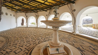 Open atrium with central fountain and detailed mosaic pattern in the floor, Kalithea, Kallithea,