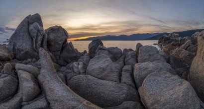 Sunset, rocky coast near Porto Pollo, Corsica, France