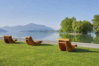 Wooden loungers on Lake Zug, behind the Rigi, Villette, Park, Cham, Canton Zug, Switzerland