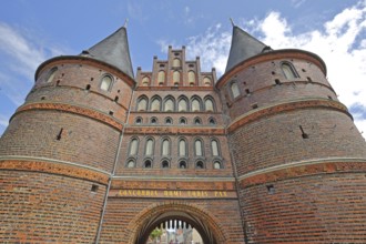 Historic Holstentor with trapdoor, view upwards, perspective, Brick Gothic, brick building, city