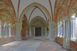 Paradise with columns and portal of the Gothic cathedral, vestibule, vault, brick church, Old Town,