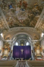 Interior with large purple Lenten cloth in front of the high altar, baroque parish church of St