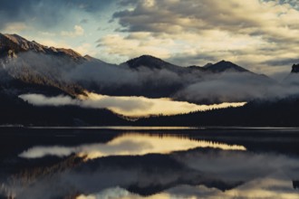 Sunrise with reflections in the Plansee in Tyrol in the Alps in Austria