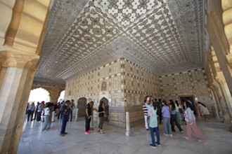 Visitors in the audience hall in the Amber Fort or fortress, Jaipur, Rajasthan, India