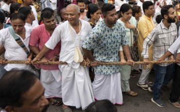 Hindu devotees takes part in Rath Yatra religious procession Guwahati, India on June 27, 2025. Rath