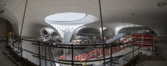 Underground cathedral, view of a modern interior under construction with glass roof, construction