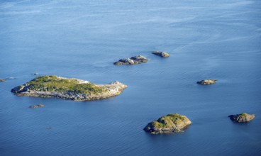 Small rocky islands in the sea, archipelago islands, near Henningsvær, Vågan, Lofoten, Nordland,