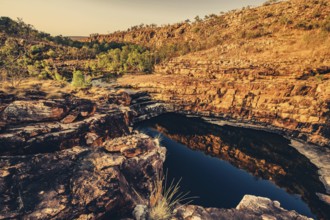 Bell Gorge waterfall, a body of water in north-west Australia in the Kimberley. Sunrise in the