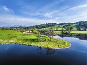 Farms over Esthwaite Water from drone, Lake District National Park, Cumbria, UK