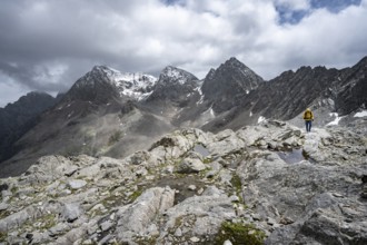 Mountaineer, Small mountain lakes in rocky mountain landscape, Niedere Gradenscharte, summit of