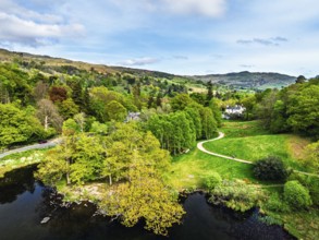 Farms and Mountains over road A591 from a drone, Grasmere Lake, Grasmere, Ambleside, Lake District,