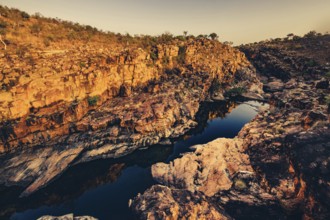 Bell Gorge waterfall, a body of water in north-west Australia in the Kimberley. Sunrise in the
