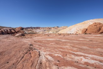 Layered rock formations along the Fire Wave Trail at Valley of Fire State Park near Overton, Nevada