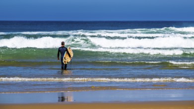 Surfer on Contis beach, Saint Julien en Born, Saint-Julien-en-Born, Landes, France