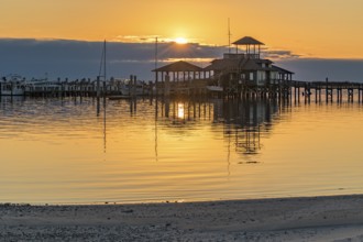 Biloxi Schooner Pier Complex at sunset on the Gulf of Mexico at Biloxi, Mississippi, USA