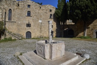 Fountain, Agyrokastrou, Former castle courtyard with fountain and central Tor tor, characterised by