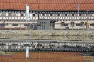 Armoury museum built in 1668 with reflection, half-timbered house, pond, bank, Suhl, Franconia,