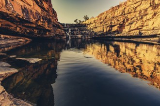Bell Gorge waterfall, a body of water in north-west Australia in the Kimberley. Sunrise in the