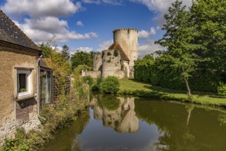 The river Loir and the castle with donjon in Alluyes, Centre-Val de Loire, France