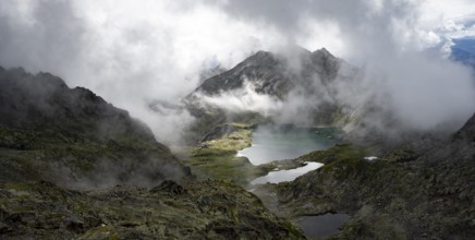 View of mountain landscape with mountain lakes Wangenitzsee and Kreuzsee, cloudy mountain peaks,