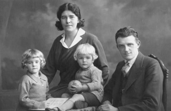 Family photo, 1920s, Family portrait with parents and two children in formal dress, Historical