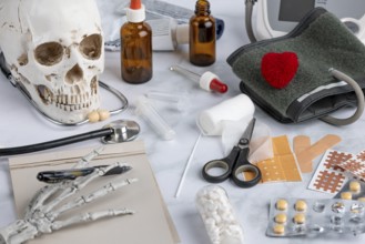 Skull with various medical instruments and medication