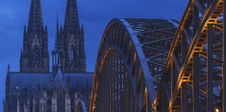 Cologne Cathedral and the Hohenzollern Bridge illuminated with LED lights, Cologne, North