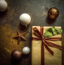 Close-up view of a beautifully wrapped gift parcel featuring a brown paper exterior and a rich