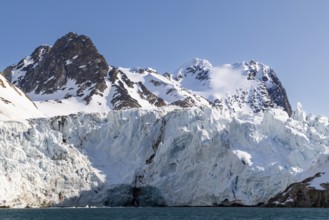 Glacier tongue, ice, edge, mountain peak, sea, Fugelfjorden, Spitsbergen, Svalbard