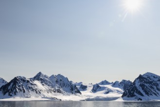 Glacier tongue, ice, mountain range, sea, sunbeams, Smeerenburg, Spitsbergen, Svalbard