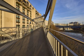 Modern architecture, footbridge, metal railing, river Saar, blue sky, cirrostratus clouds, evening