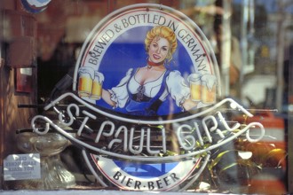 Beer advert for a Bavarian beer in the window of a bar, New York City, USA