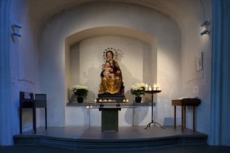 Interior view of the chapel, sacrificial candles, Mary and Jesus, Peter and Paul parish church,