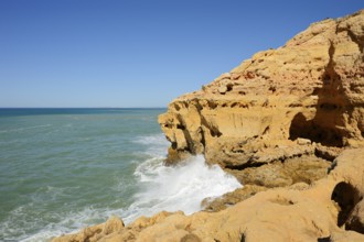 Surf on the rocky coast, Carvoeiro, Algarve, Portugal