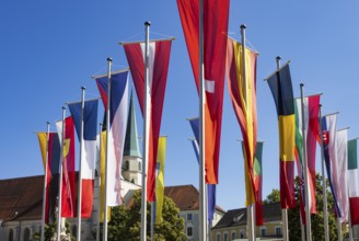 National flags at Kapellplatz with the collegiate parish church of St Philip and St James, place of