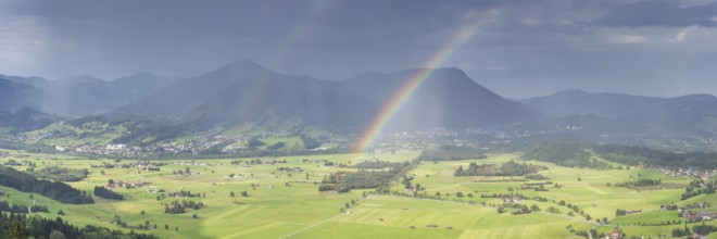 Panorama from Grünten over the Illertal with rainbow to Blaichach and Immenstadt, behind
