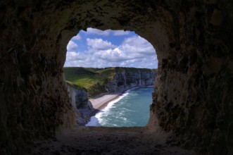View through the eye of the panda, L'oeil du Panda, rock window, cave, in the rock arch Falaise