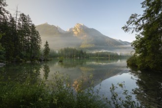 Magical sunrise with fog at Hintersee near Ramsau in Berchtesgadener Land