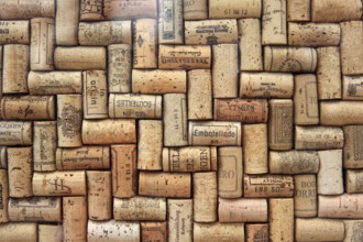 Corks from wine bottles laid as a regular pattern, wine corks, red wine