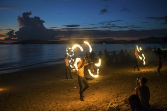 Fire show, jugglers with fire, Ao Nang Beach, sunset, Ao Nang, Krabi, Thailand