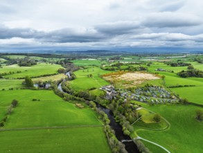 Farms over Ullswater Lake from drone, Pooley Bridge, Lake District National Park, Cumbria, England,