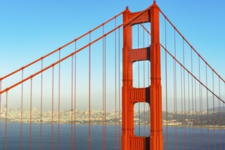 View of Golden Gate Bridge and financial district in the distance, San Francisco, California, USA