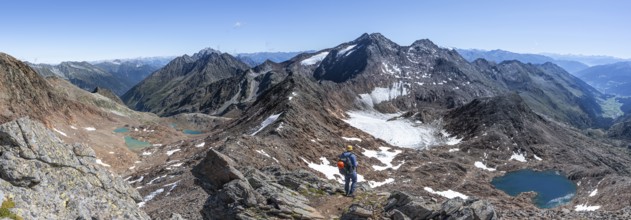 Mountain panorama, mountaineer in rocky high mountain landscape at the Rotgratscharte, view of