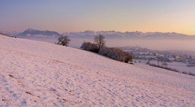 Village in the fog and in the light of dusk, behind the Rigi, Hohenrain, Seetal, Canton Lucerne,