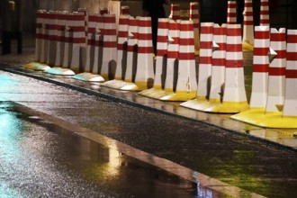 Security barrier for an event, large city at night, Germany