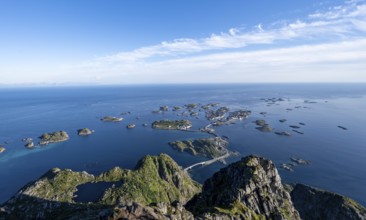 View of the sea and archipelago islands with the village of Henningsvær, Festvagstinden peak,