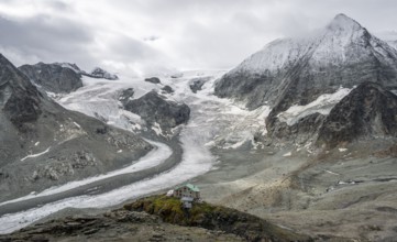Mountain hut Cabane des Dix in front of glacier Glacier de Cheilon and summit Mont Blanc de