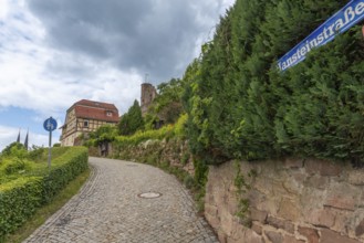 Path to the medieval Hanstein castle ruins, built on a red sandstone rock, Bornhagen, Eichsfeld
