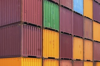 Busy international industrial port with freight and shipment docks and cargo containers