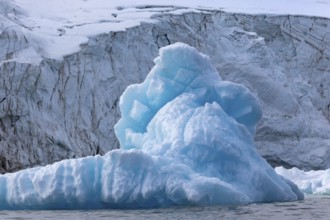 Iceberg in front of glacier tongue, sea, Alkefjellet, Spitsbergen, Svalbard